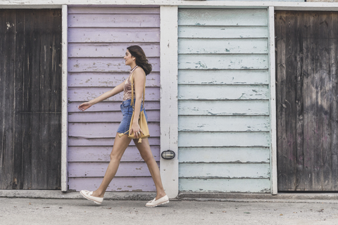 Walking young woman stock photo