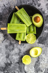 Avocado lime ice lollies in bowl - SARF03578