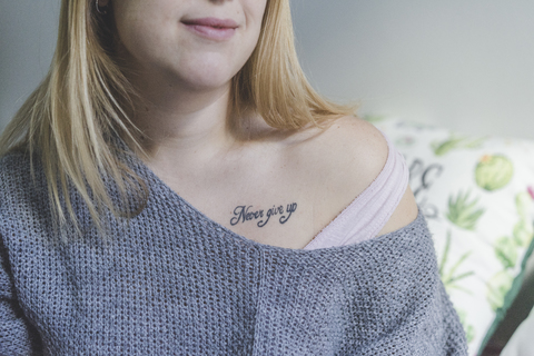 Woman with tattoo, partial view stock photo