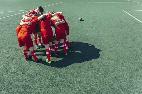 High angle view of soccer players huddling on field - FSIF01750