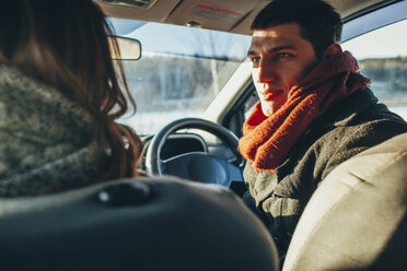 Young woman staring at woman in car - FSIF01862