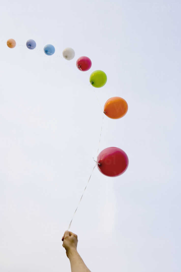 Helium balloons tied to a string stock photo