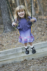 Young girl playing on a swing - FSIF02378