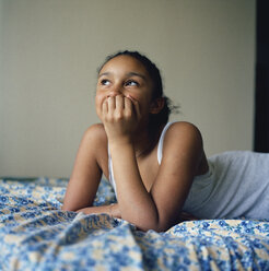 Girl lying on her bed - FSIF02389