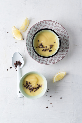 Lemon mousse with cacoa nibs stock photo