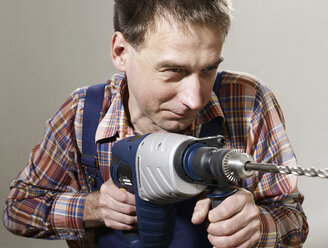 A man using a large drill - FSIF02629