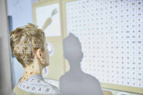 Student in class at interactive whiteboard stock photo