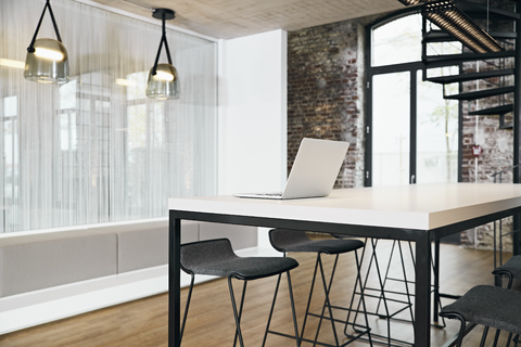 Laptop in meeting room in modern office stock photo