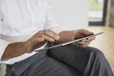 Close-up of businessman using tablet - PDF01451