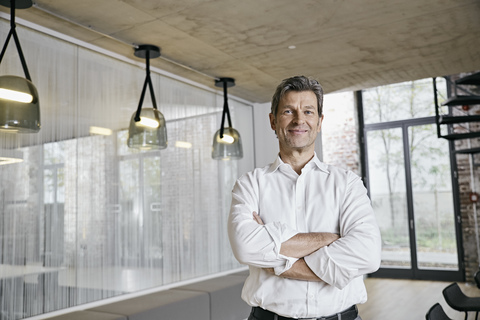 Portrait of confident businessman in modern office stock photo