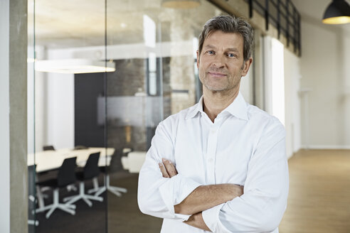 Portrait of confident businessman in modern office - PDF01464