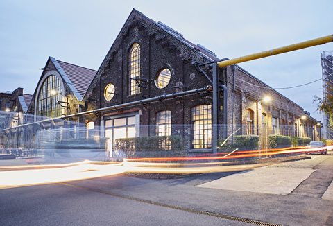 Long exposure of brick building at dusk stock photo