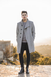 Portrait of fashionable young man wearing grey coat - AFVF00169