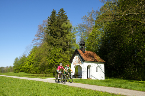 Germany, Bavaria, Upper Bavaria, Bad Heilbrunn, Antonius Chapel, cyclists stock photo