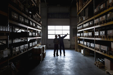 Two manual workers in a metal parts warehouse - FSIF02664