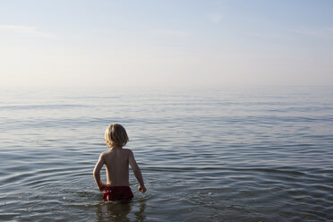 A young boy standing in the sea - FSIF02816