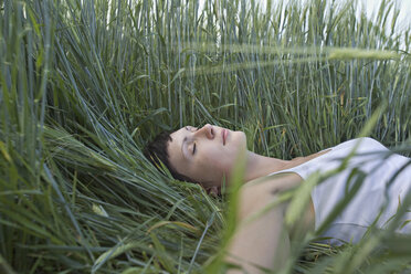 A woman sleeping in grass - FSIF02877