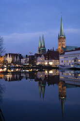 Germany, Schleswig-Holstein, Luebeck, Old town, Obertrave river, St Mary's Church and St. Petri church at blue hour - WIF03481