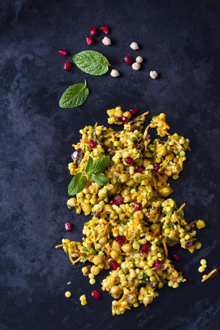 Couscous salad with chick peas and cranberries on dark ground stock photo