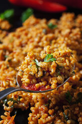 Spoon of bulgur wheat salad, close-up - CSF28979