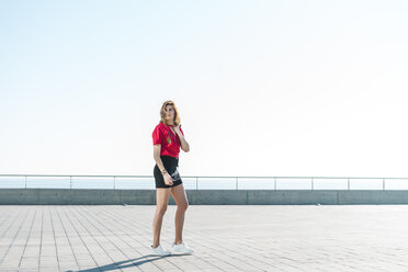 Fashionable young woman on waterfront promenade - AFVF00266