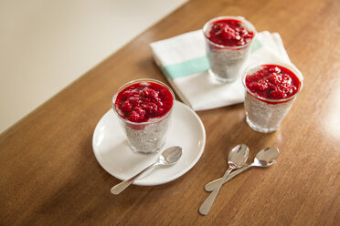 Chia pudding with rasberry topping on kitchen counter - JHAF00028