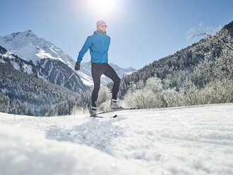 Austria, Tyrol, Luesens, Sellrain, cross-country skier in snow-covered landscape - CVF00155
