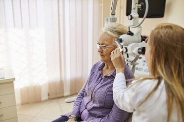 ENT physician examining ear of a senior woman - ZEDF01242