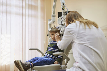 ENT physician examining ear of a boy - ZEDF01245