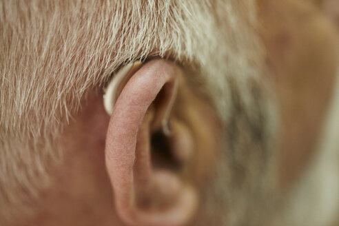 Close-up of senior man with hearing aid - ZEDF01254