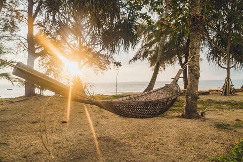 Thailand, Phi Phi Islands, Ko Phi Phi, hammock on the beach in backlight - KKAF00894