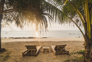 Thailand, Phi Phi Islands, Ko Phi Phi, sun loungers on the beach in backlight - KKAF00895