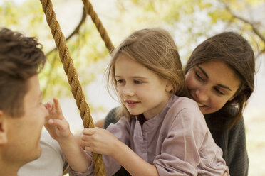 Close up of family on swing - CAIF00171