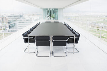 Empty conference room overlooking city - CAIF00282