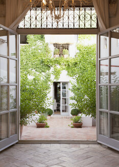 View of courtyard through French doors - CAIF00629