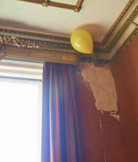 Balloon floating in corner of ornate room - CAIF00745