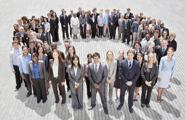Portrait of smiling business people forming circle - CAIF01193