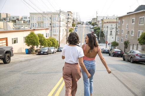 Two young women walking down the street - SUF00508