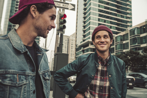 Two young men in the city on the move stock photo