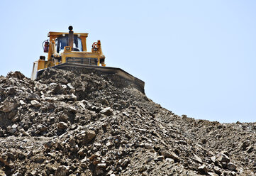 Bulldozer working in quarry - CAIF01338