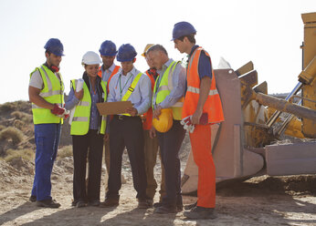 Workers and business people talking on site - CAIF01373