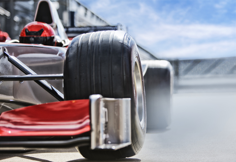 Race car sitting on track stock photo