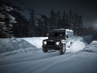 Austria, Tyrol, Stubai Valley, off-road vehicle in winter at night - CVF00180