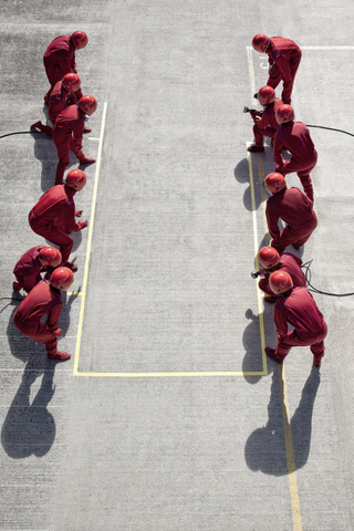 Racing team ready at pit stop stock photo