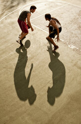 Men playing basketball on court - CAIF02022