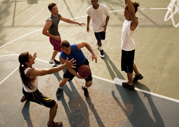 Men playing basketball on court - CAIF02028