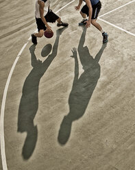 Men playing basketball on court - CAIF02029