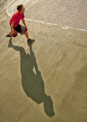 Man playing basketball on court - CAIF02033