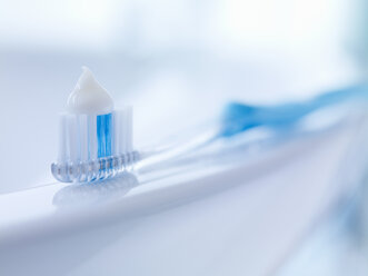 Close up of toothbrush with toothpaste - CAIF02121