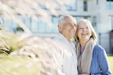 Older couple smiling outdoors - CAIF02168